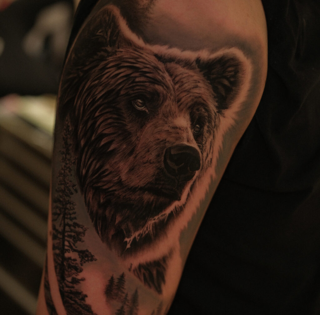 Black and grey realism bear head tattoo on arm